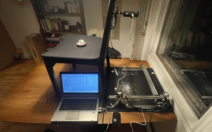 Image of a plotter connected to a laptop